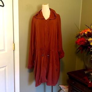 Torrid Sz 6 long line hooded jacket. Pockets, zip & snap closure.